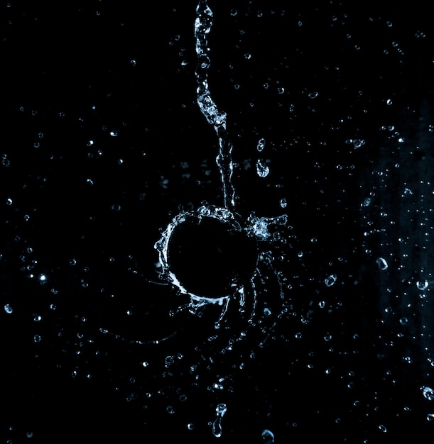 Dynamic liquid splash in the black background