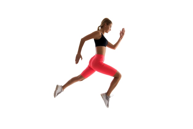 Dynamic movement. Woman runner isolated on white. Jogger running. Sporty runner in fashionable sportswear. Fitness run sport motivation. Strong and fit. Athletic woman sprinter or runner. Best runner.