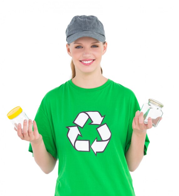 Dynamic pretty environmental activist holding two jars