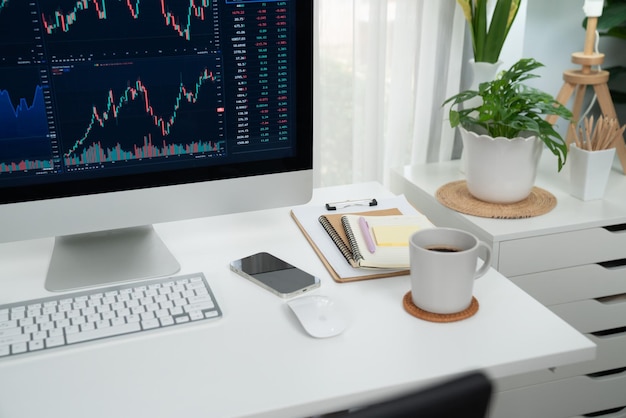 dynamic stock exchange market's graph display on computer and laptop screen workspace with stock graph display for stock trader workspace with stock graph display for stock trader tastemaker