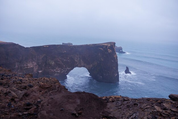 Photo dyrholaey peninsula icelandic shoreline