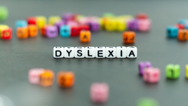 Photo dyslexia word put in white letter blocks reading problems