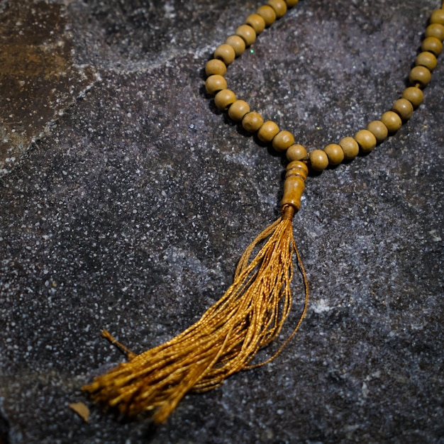 Dzikir praying by counting the prayer beads