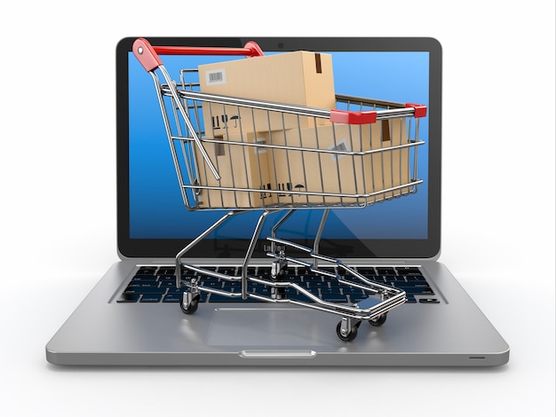 E-commerce. Shopping cart on laptop.