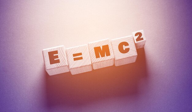 Photo e mc 2 word with wooden cubes