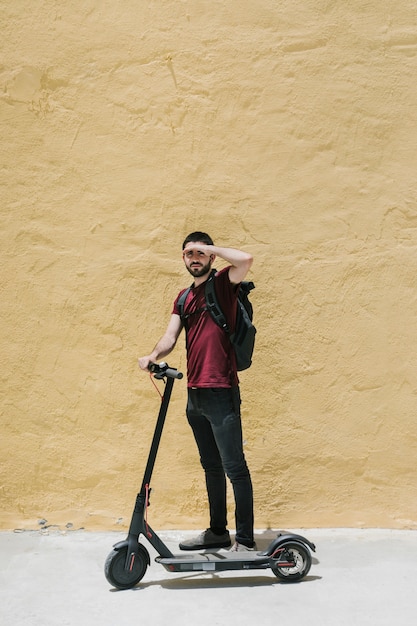 E-scooter rider covering his eyes