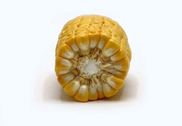 Ear of corn in a cut on a light background Natural product Natural structure Natural color Closeup