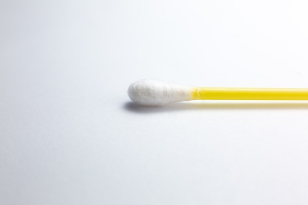 Ear cotton swab on the white background.