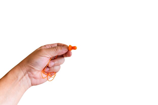 Ear plugs hearing protection in men's hand on white background,safety concept