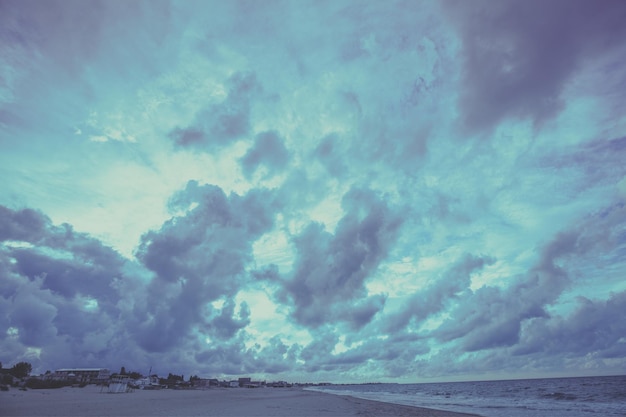 Early morning on the beach Pink purple sunrise over the sea Pastel color