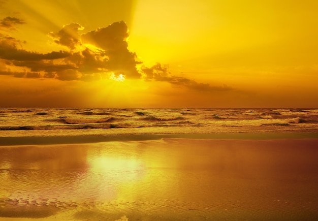 Early morning Golden sunrise over the sea with a cloudy sky Stormy weather