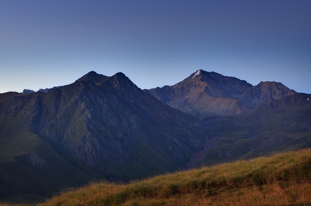 Early morning in the mountain area. Dawn over the mountains and valleys of the North Caucasus in Russia