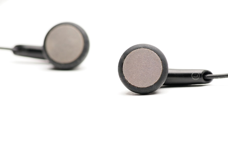 Photo earphone for music player and smart phone on isolated white