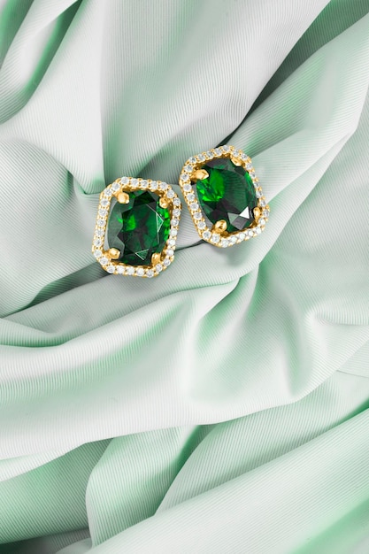 Photo earrings on green silk