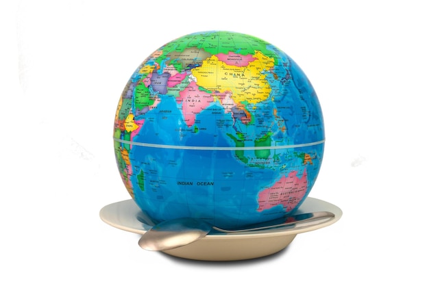 Earth globe inside an empty plate showing Asia and Australia as a concept of world hunger