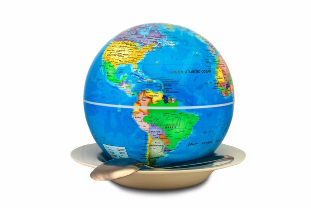 Earth globe inside an empty plate where America is shown as a concept of world hunger