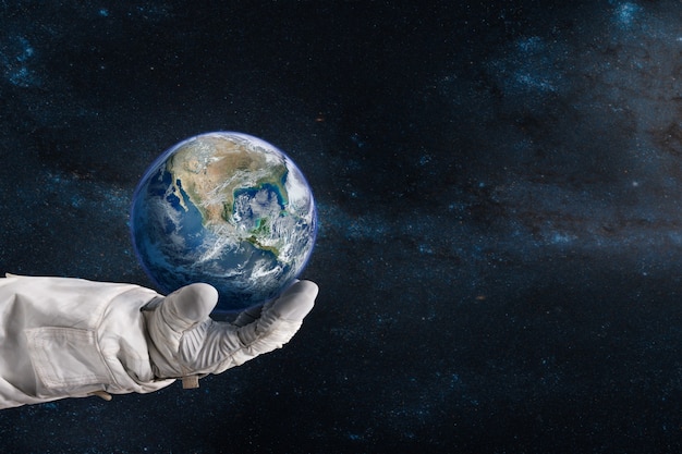 Earth in the hand of astronaut