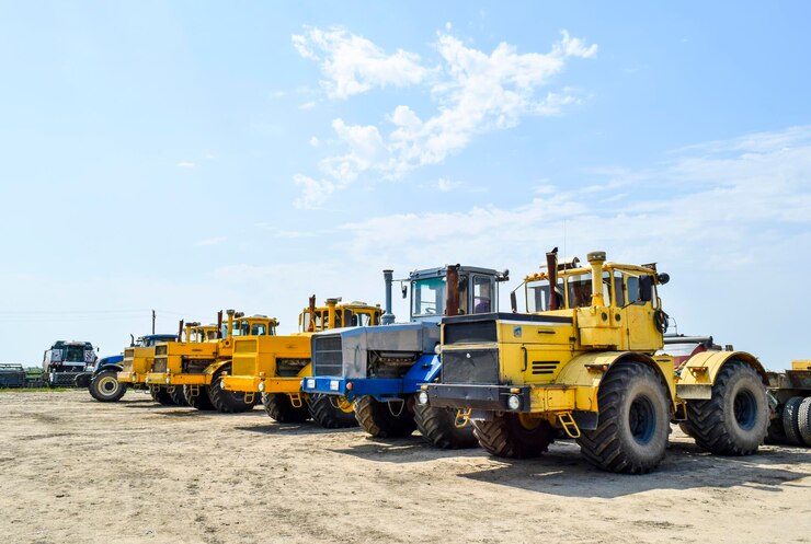 Photo earth movers against sky