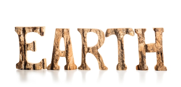 Earth word made of wooden letters on white