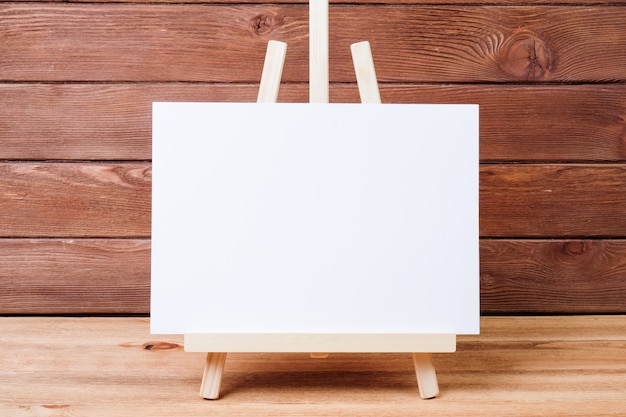 easel on wooden background