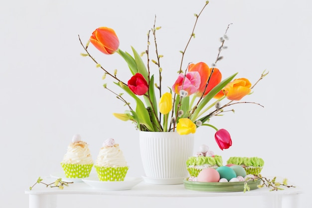 Easter arrangement with tulips and cupcakes