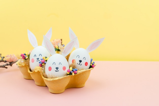 Easter background with eggs in the form of rabbits