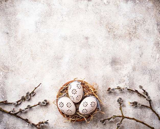 Easter background with willow and eggs