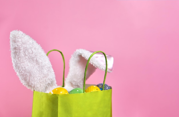 Easter bag with Easter decor on a pink background