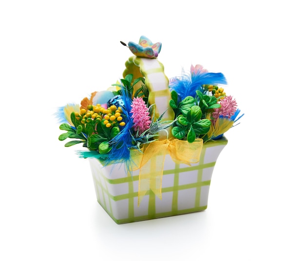 Easter basket from a flower arrangement on white background