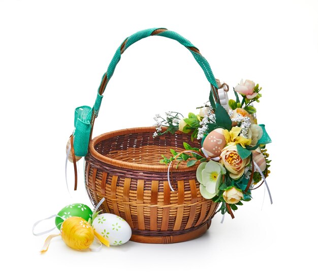 Easter basket from a flower arrangement on white background