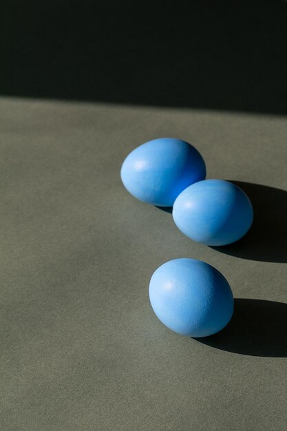 Easter blue eggs on a gray background