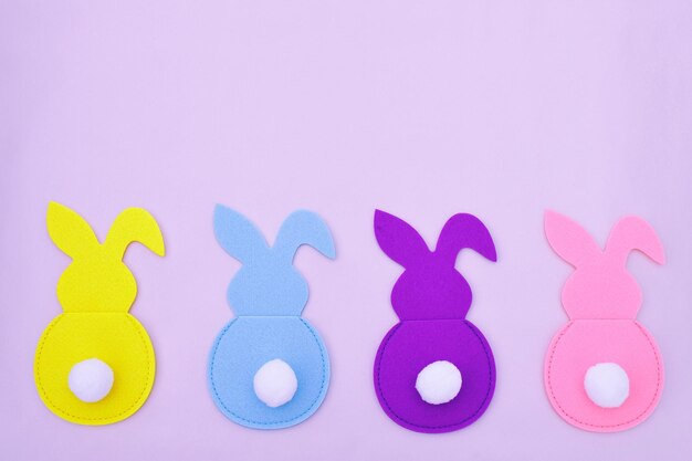 Easter bunnies on a pink background. Free space for text.