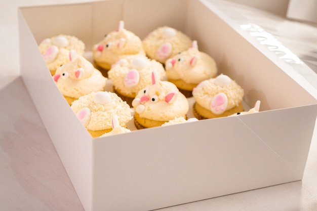 Easter bunny cupcakes in a white cupcake box.