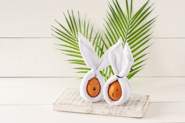 Easter Bunny ears made from napkins and eggs. Festive decoration for holiday.