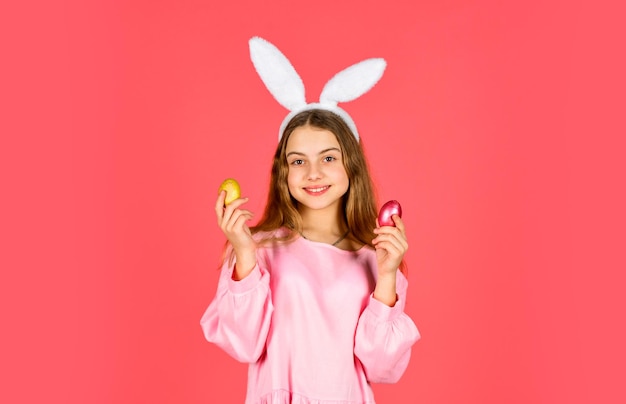 Easter bunny hold painted eggs. happy easter. smiling kid in\
rabbit ears. egg hunt on spring holiday. holiday celebration\
preparation. easter is coming. which one do you want. easter bunny\
hunt begin.