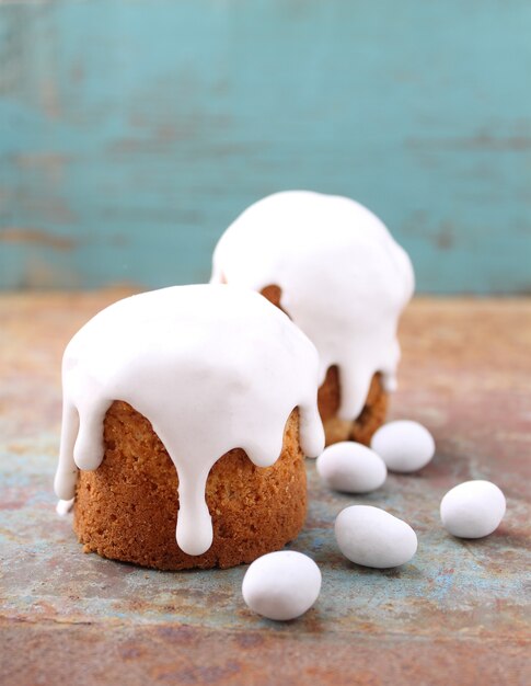 Easter cake, chocolate eggs on a wooden background. 