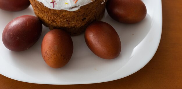 Easter cake and colored eggs. Traditional Easter baking. Easter holiday. Close-up.