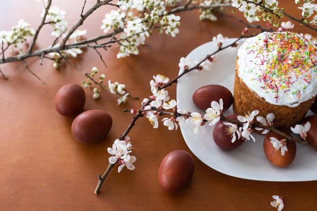 Easter cake and colored eggs. Traditional Easter baking. Easter holiday. Close-up.