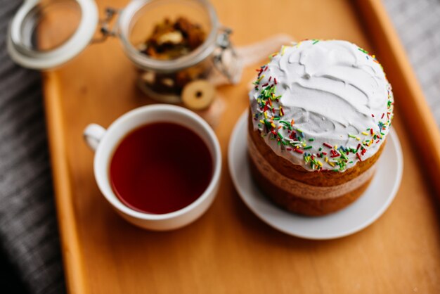 Easter cake and colorful eggs on a dark background 