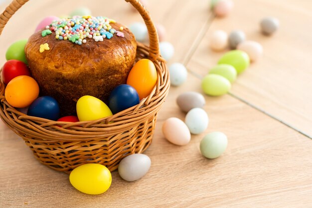 Easter cake and colorful eggs on festive Easter table.