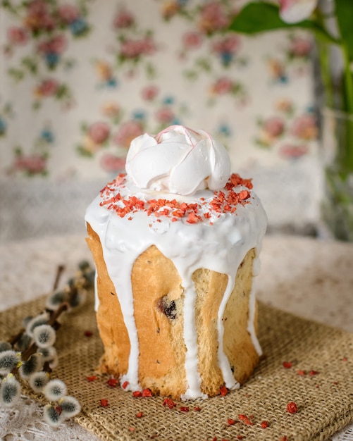 Easter cake decorated with rose-shaped meringues