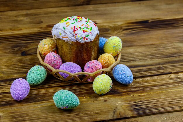 Easter cake and easter eggs on a wooden table