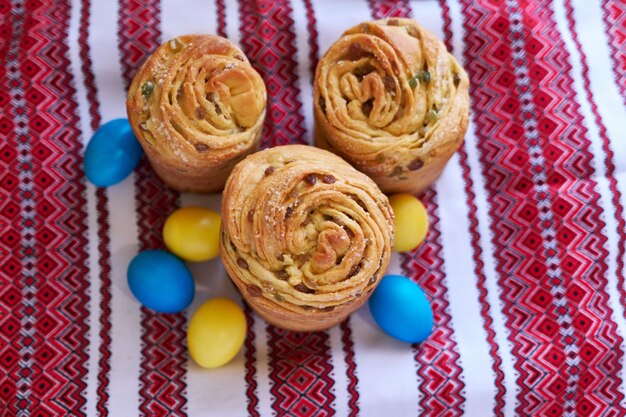 Easter cake and eggs on traditional ukrainian embroidered towel