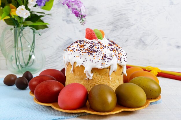 Easter cake and painted eggs on a plate