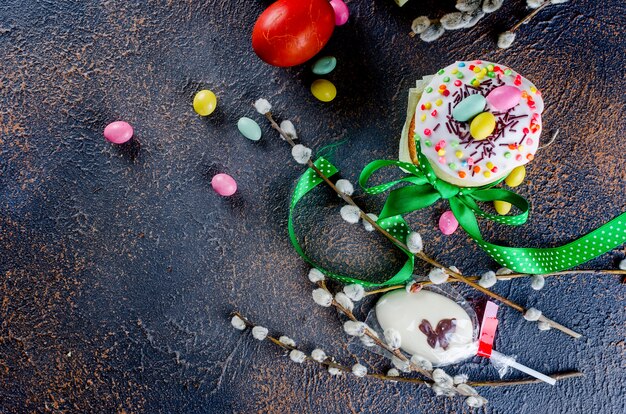 Easter cake, red eggs, holiday decorations and Place setting for Easter