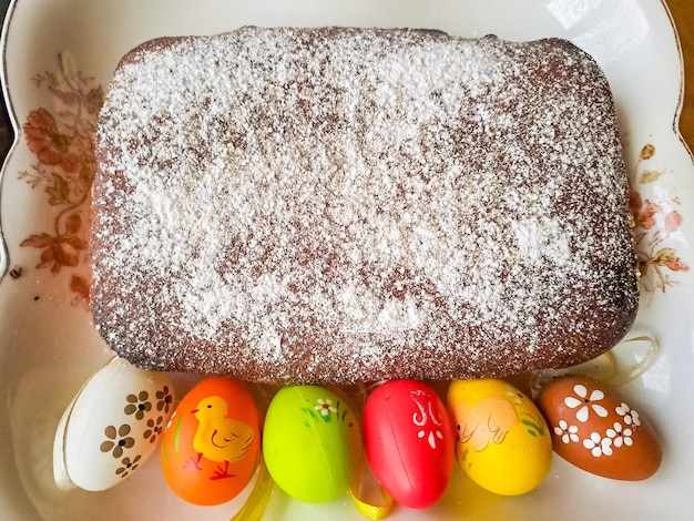 Easter cake with candied fruits and colored eggs traditional easter baking