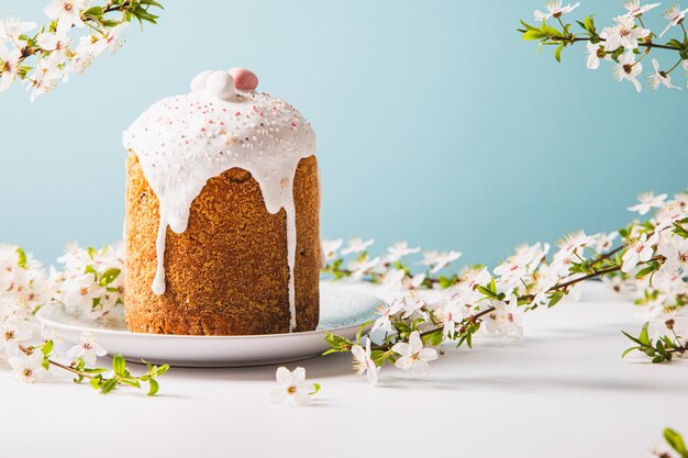 Easter cake with glace icing and decoration Postcard with Easter bread Christian traditions Copy space White background