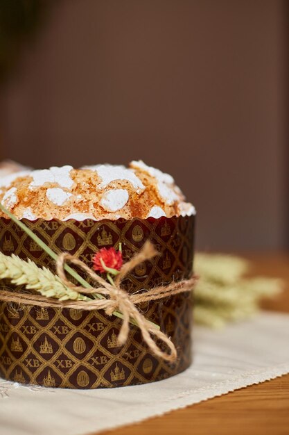 Easter cake with rustic decoration wheat on wooden table the holiday