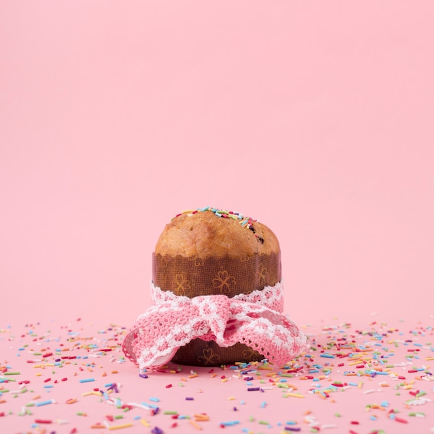 Photo easter cake with sprinkles on table