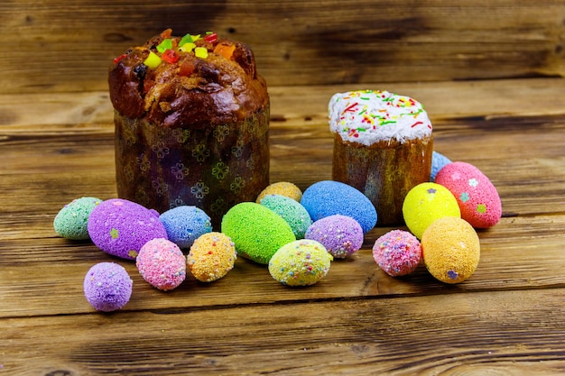 Easter cakes and easter eggs on a wooden table